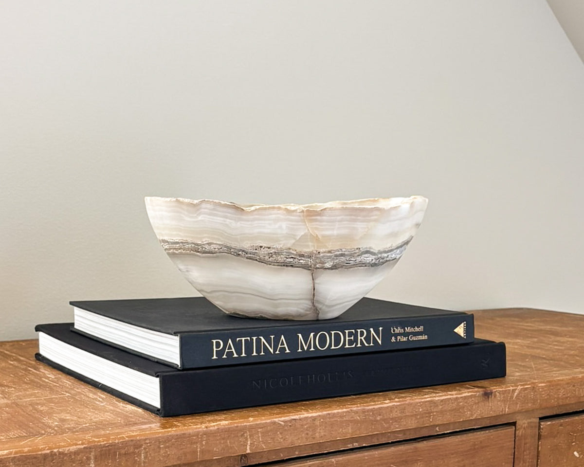 Hand-carved grey onyx bowl with natural stone veining and organic patterns
