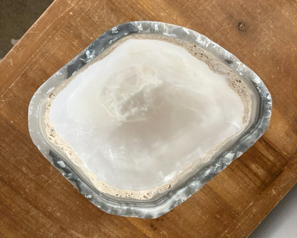 Artisan-carved grey onyx bowl with distinctive natural banding