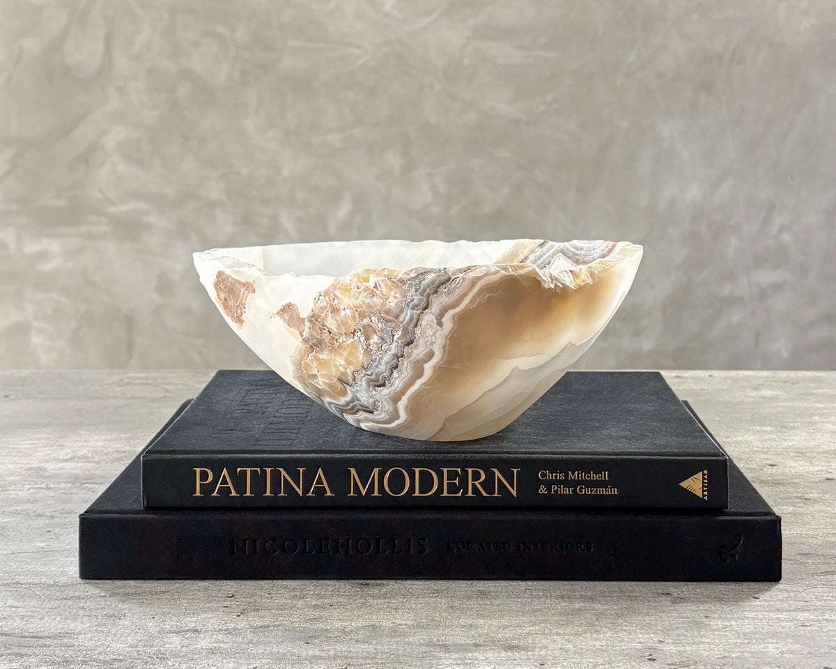 Hand-carved grey onyx bowl with natural stone veining and unique patterns