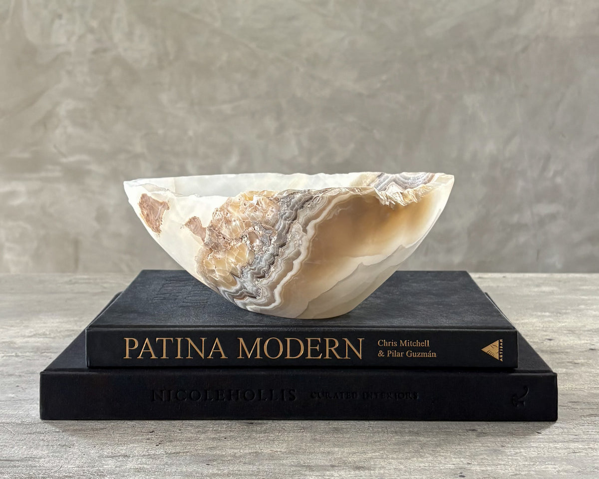 Artisan-crafted grey onyx stone bowl featuring natural variations in color and pattern