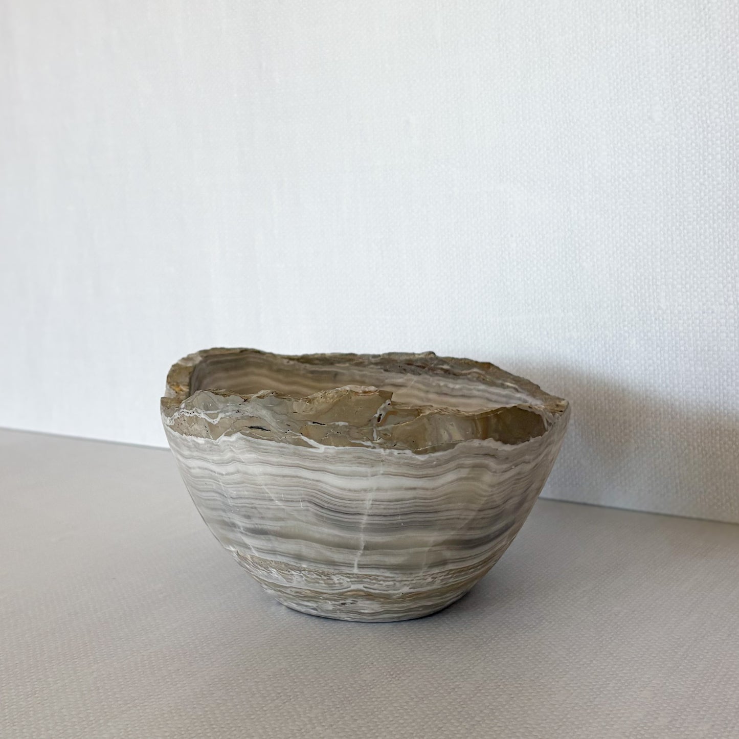 Close-up of natural veining on hand-carved grey onyx bowl