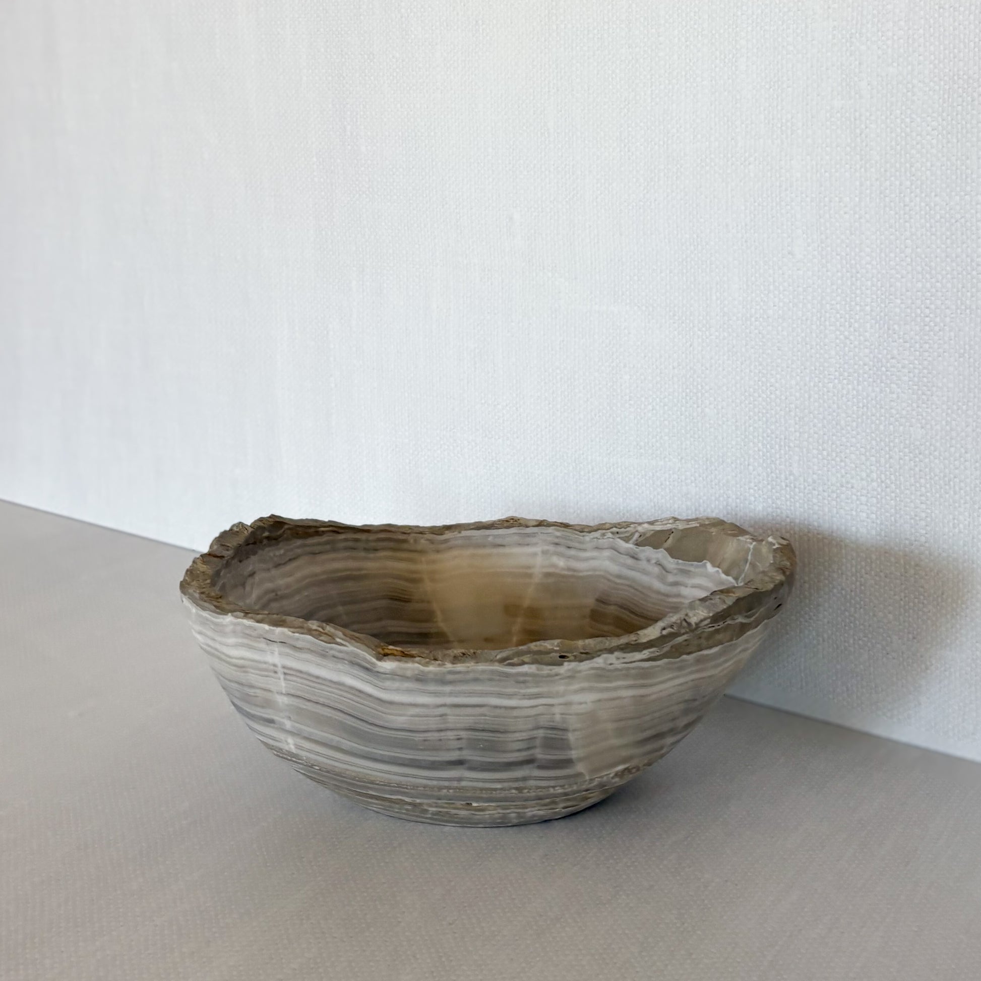 Minimalist hand-carved stone bowl made from grey onyx