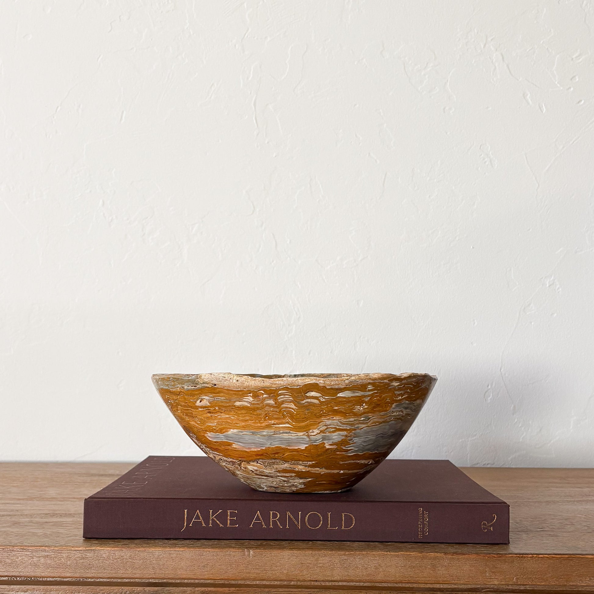 Decorative hand carved grey onyx bowl with brown and grey natural stone bands