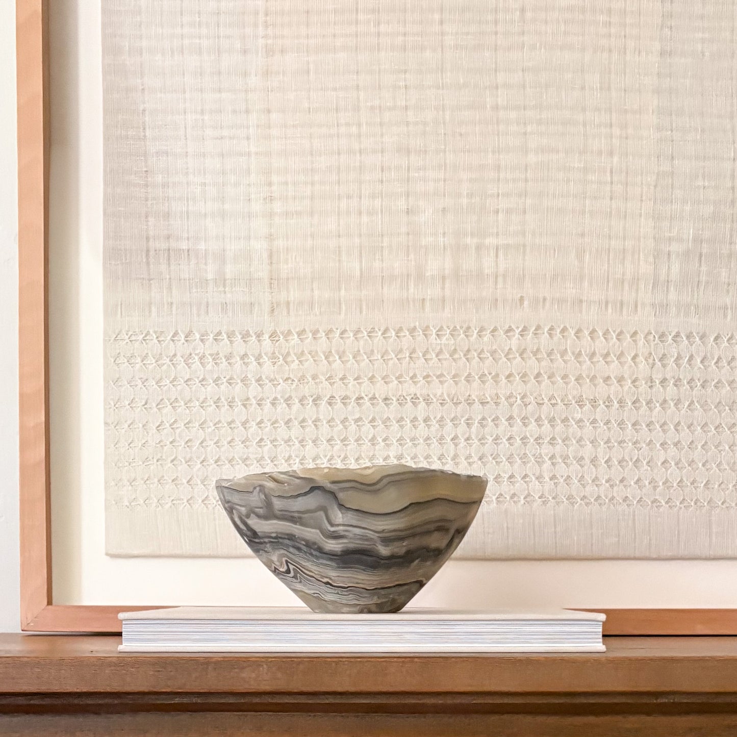 Grey onyx bowl styled on modern console table 