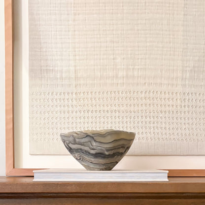 Grey onyx bowl styled on modern console table 