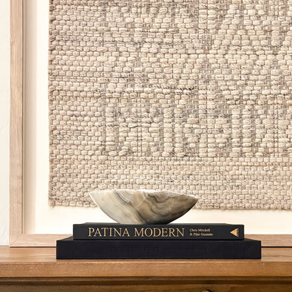 Small hand-carved grey onyx bowl with natural stone veining and polished finish