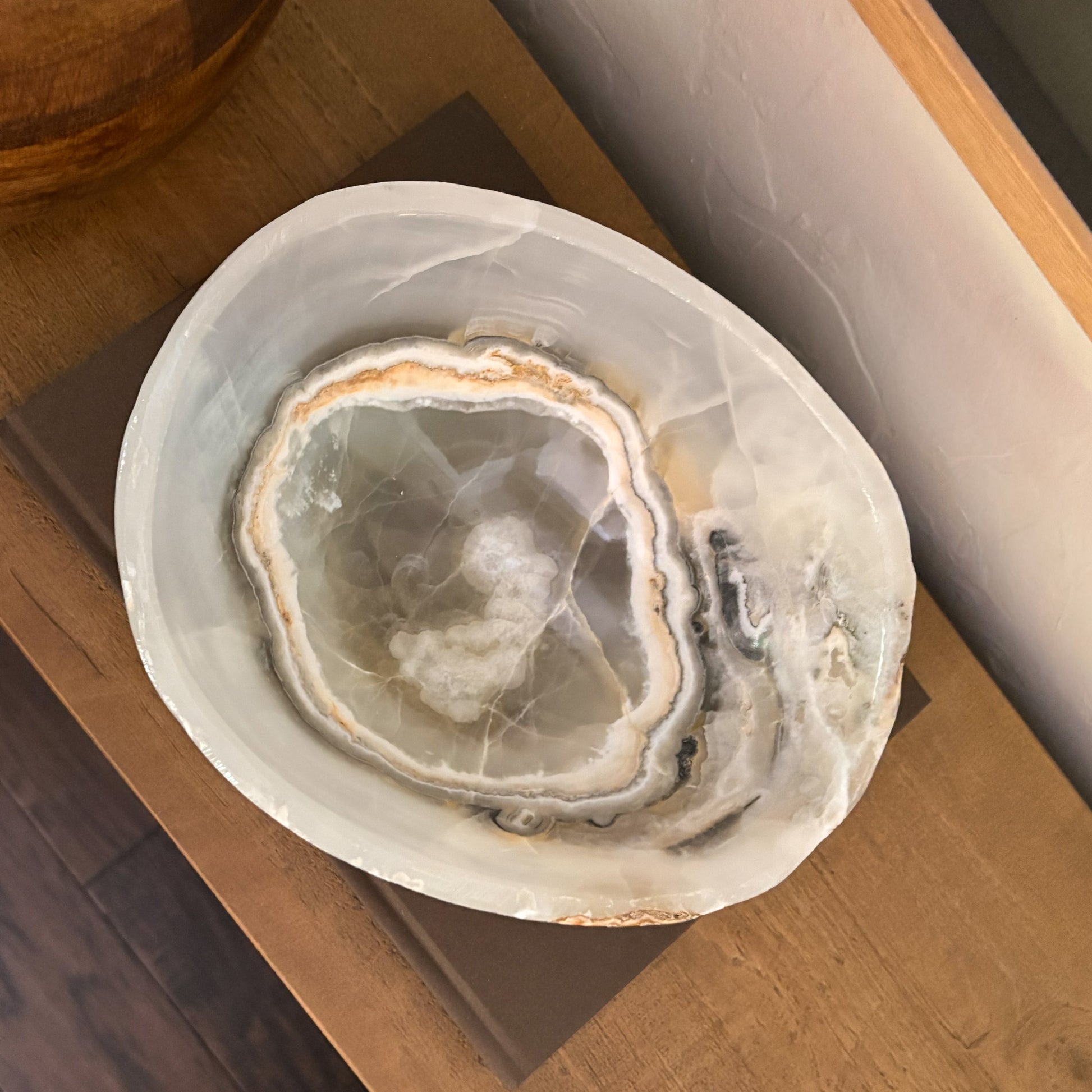 Hand-carved grey onyx bowl with natural stone veining and polished finish