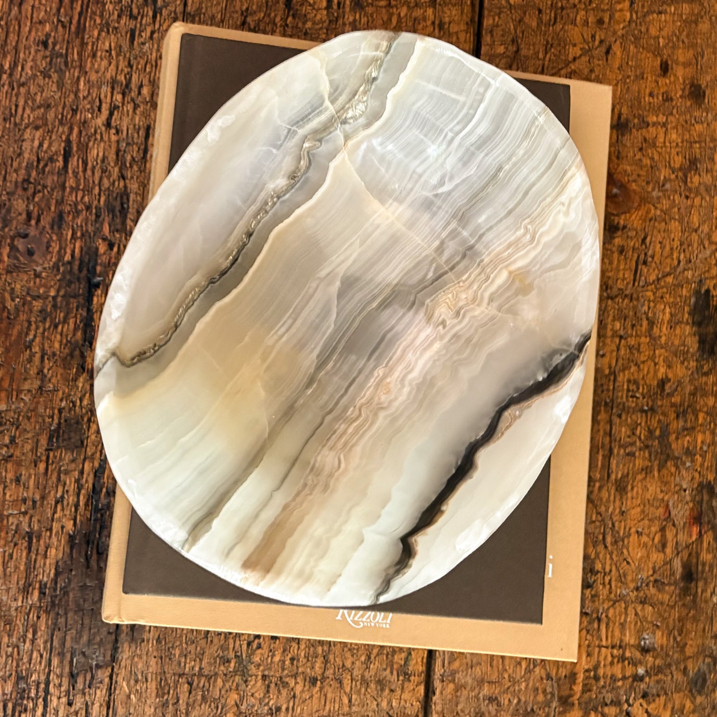 Sculpted grey onyx bowl with organic stone textures and variations