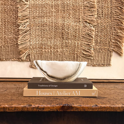 Polished grey onyx bowl showcasing natural stone patterns and veining