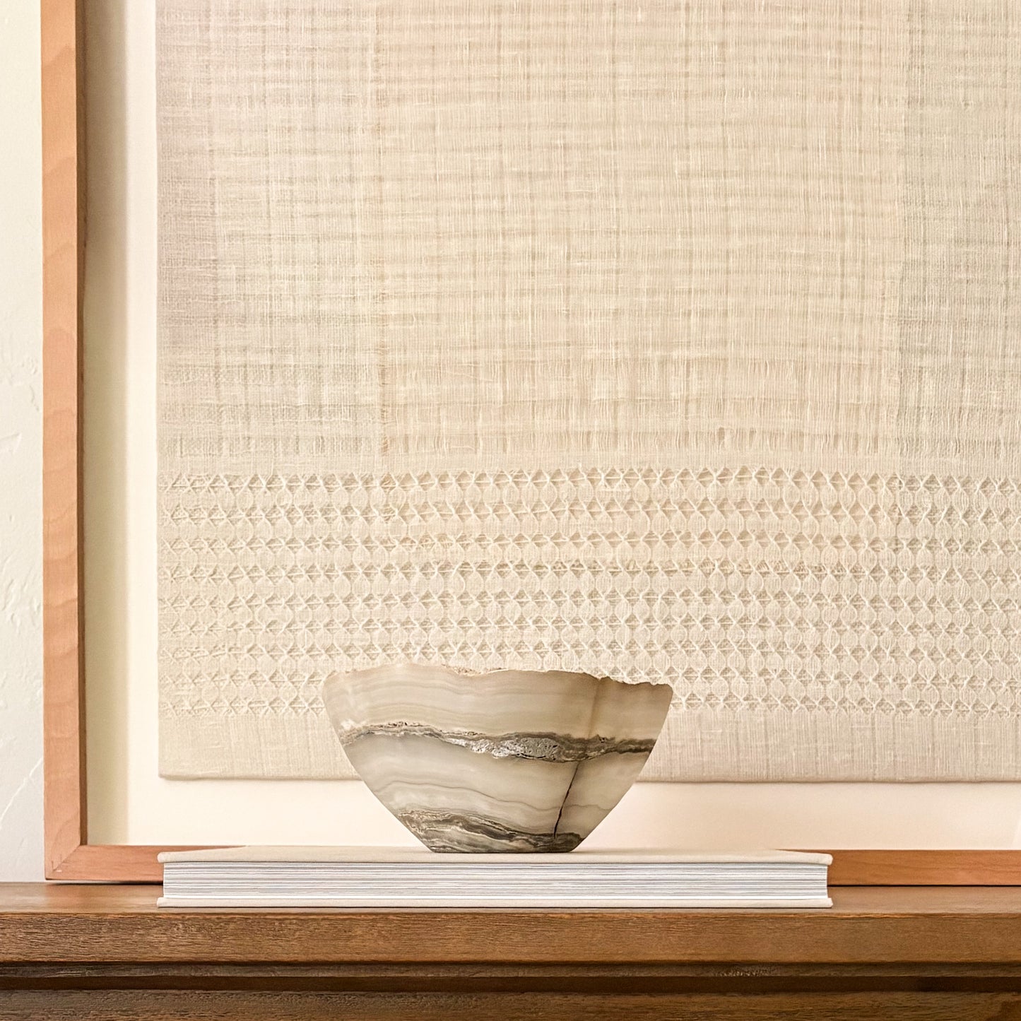 Decorative hand-carved grey onyx centerpiece bowl with natural stone variations.