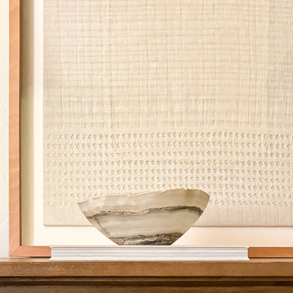 One-of-a-kind hand-carved grey onyx bowl ideal for coffee tables, consoles, and shelves.