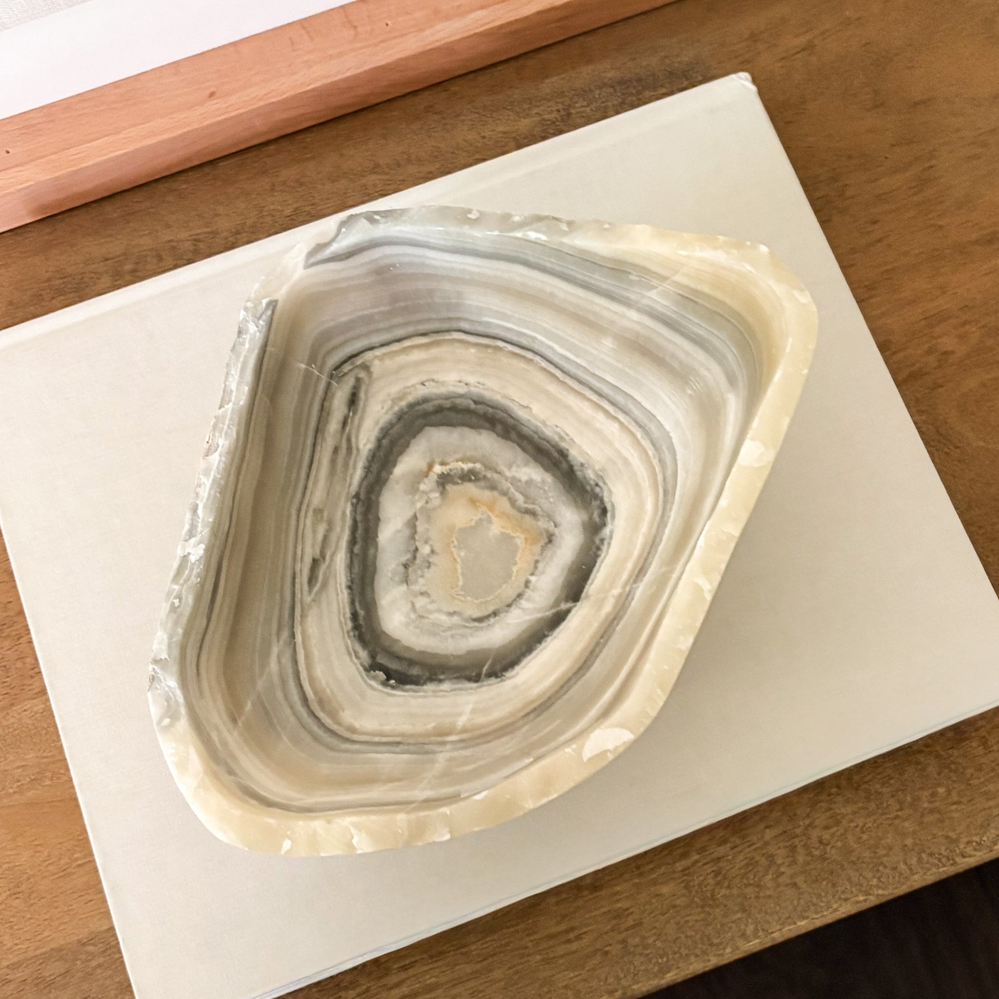 Natural grey onyx bowl with distinctive veining, hand carved for timeless home styling.