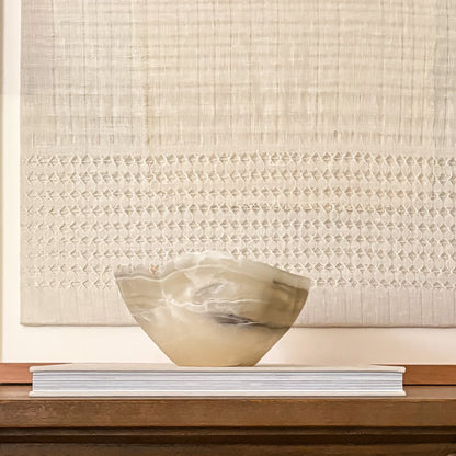 Luxury hand-carved grey onyx bowl featuring natural stone patterns and organic texture.