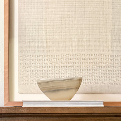 Decorative grey onyx bowl hand carved from natural stone with unique veining.