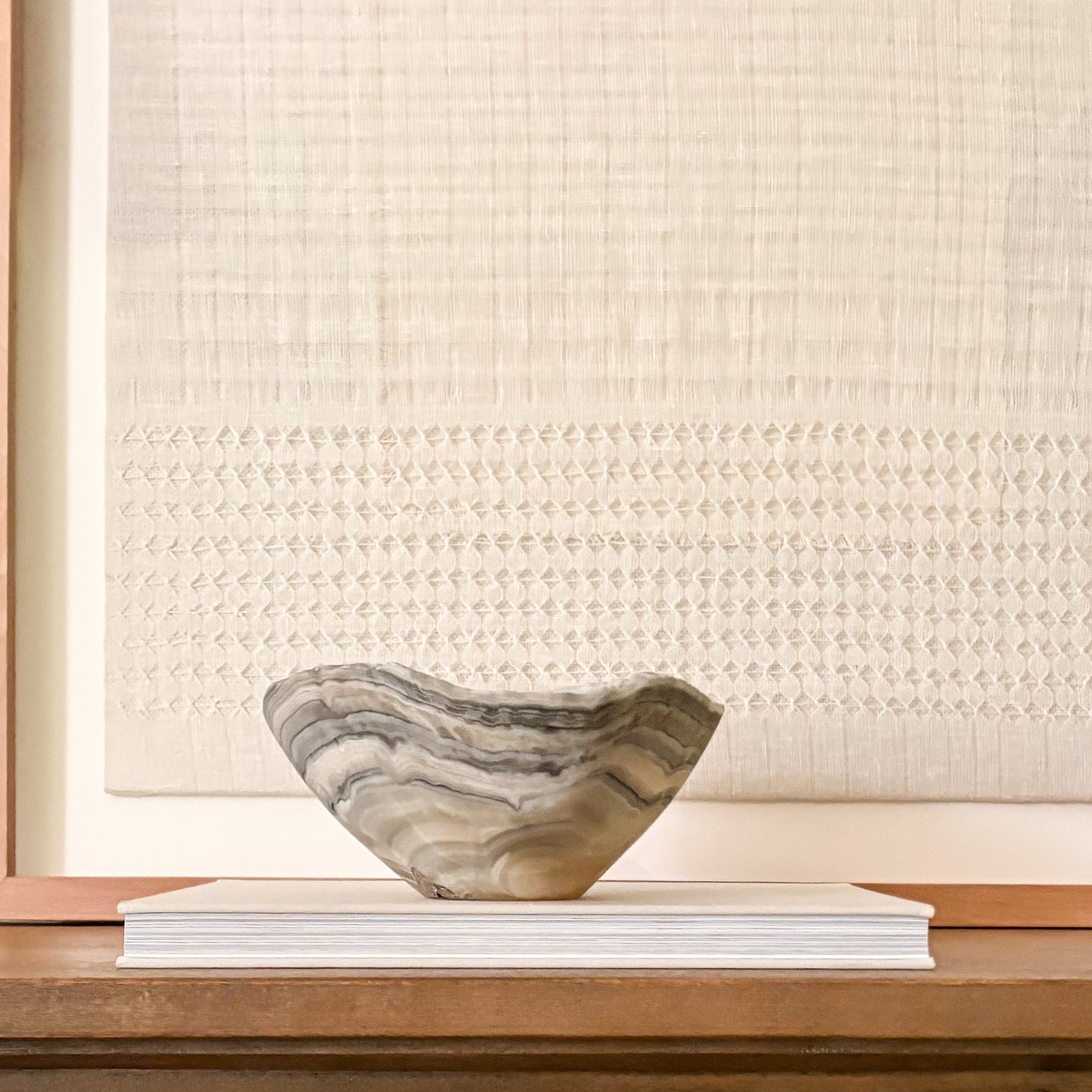 Luxury hand-carved grey onyx bowl featuring natural stone patterns and organic texture.