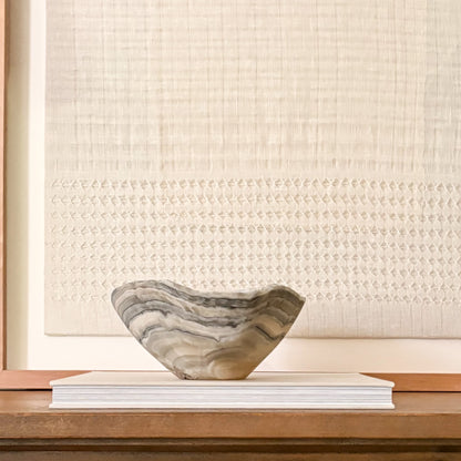 Luxury hand-carved grey onyx bowl featuring natural stone patterns and organic texture.