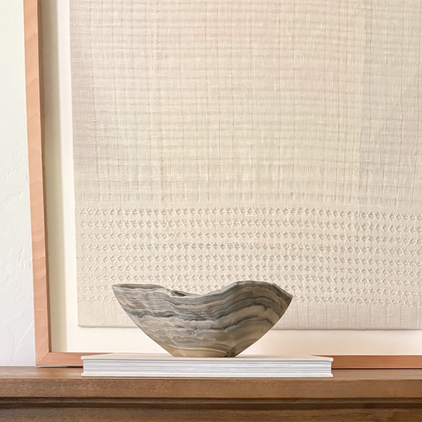 Decorative grey onyx bowl hand carved from natural stone with unique veining.