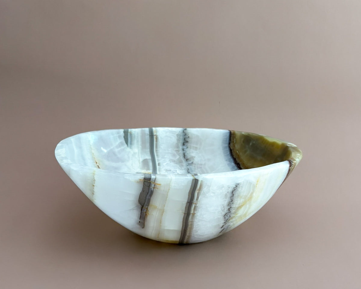 Hand-carved olive onyx bowl with cream, white, grey, and olive green natural stone veining