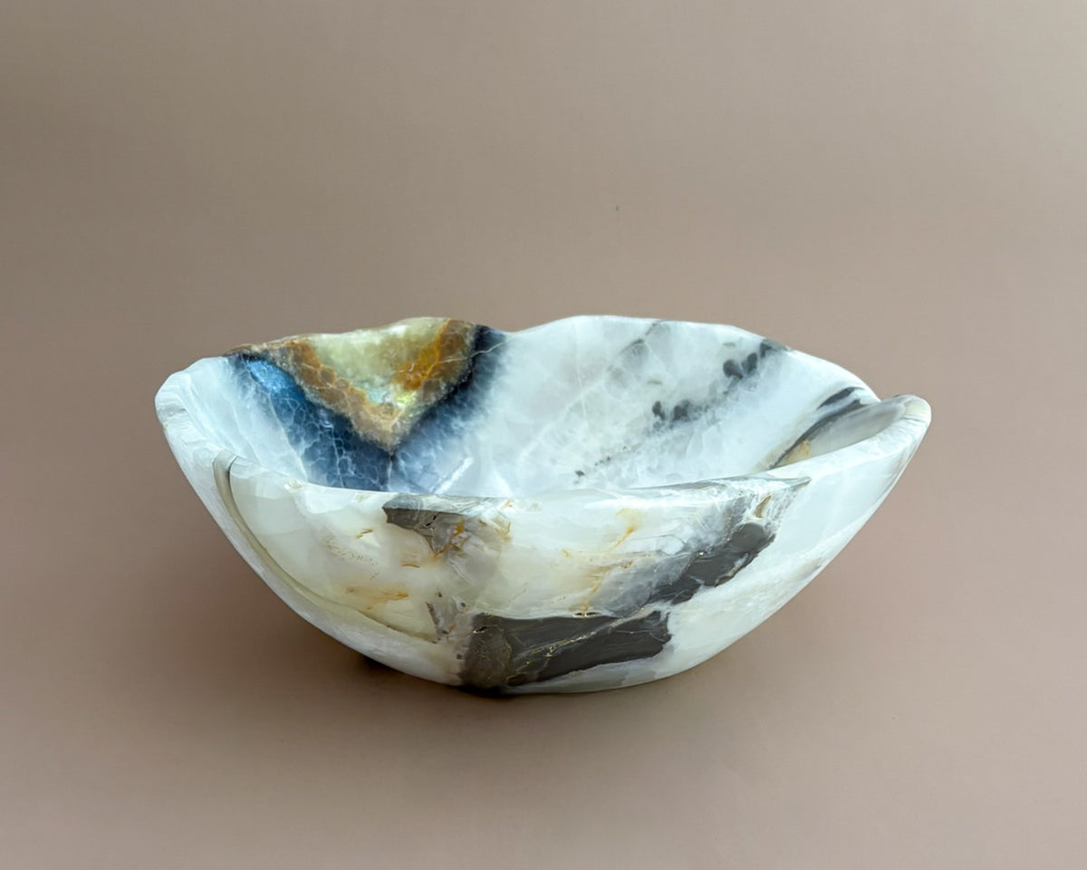 Hand-carved olive onyx bowl with cream, white, grey, and olive green natural stone veining