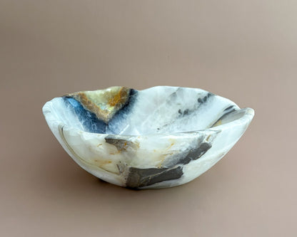 Hand-carved olive onyx bowl with cream, white, grey, and olive green natural stone veining