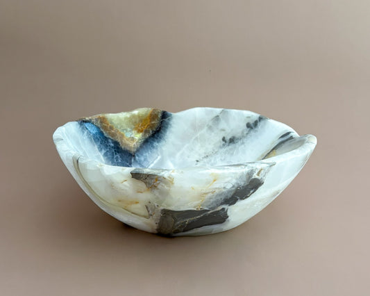 Hand-carved olive onyx bowl with cream, white, grey, and olive green natural stone veining