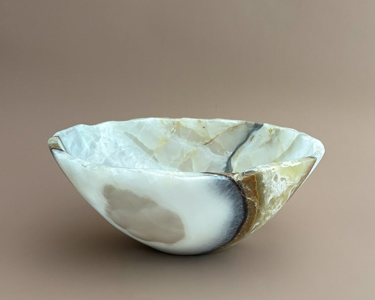 Hand-carved olive onyx bowl with cream, white, grey, and olive green natural stone veining