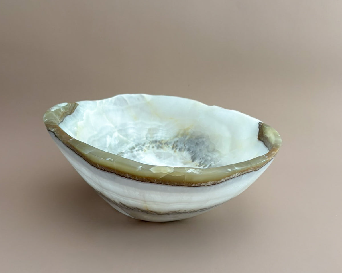 Hand-carved olive onyx bowl with cream, white, grey, and olive green natural stone veining