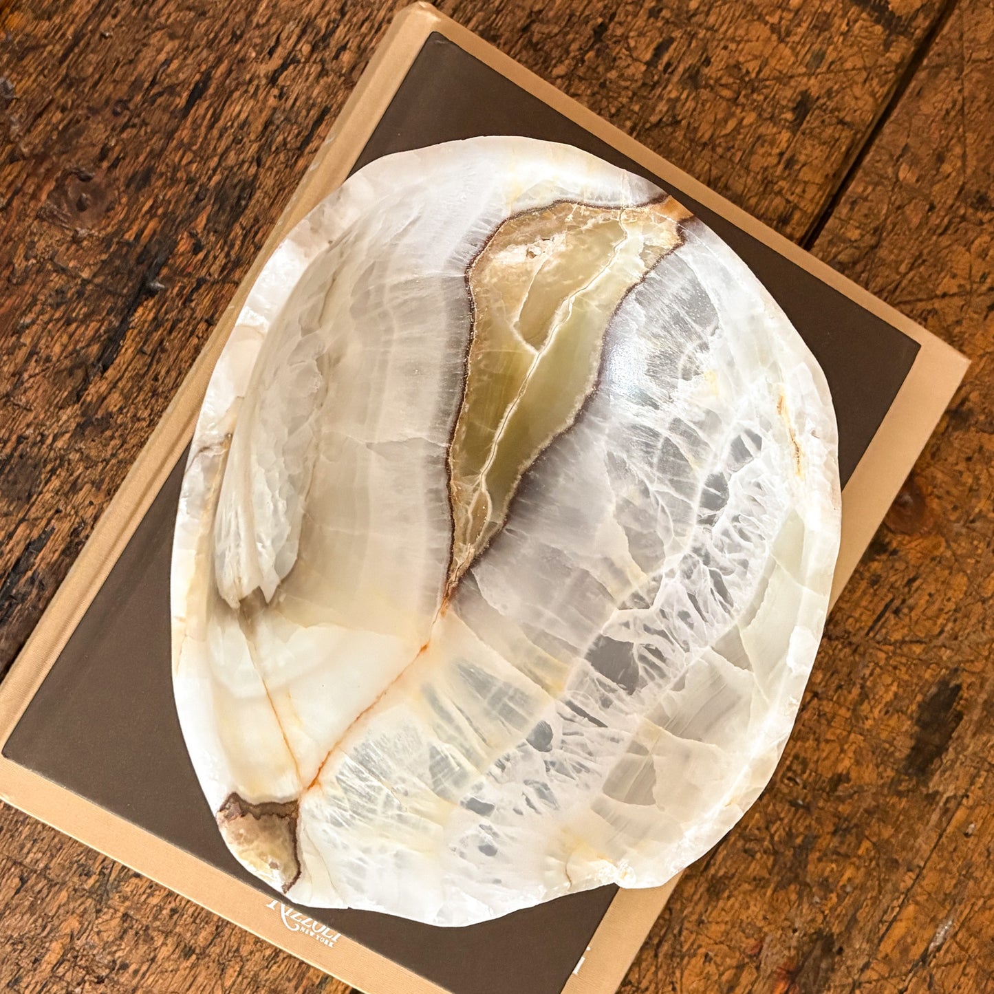 Detailed view of hand carved olive onyx bowl with polished smooth surface