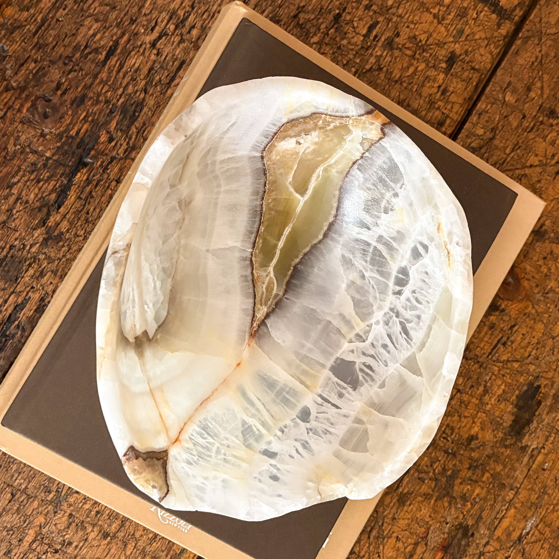 Detailed view of hand carved olive onyx bowl with polished smooth surface