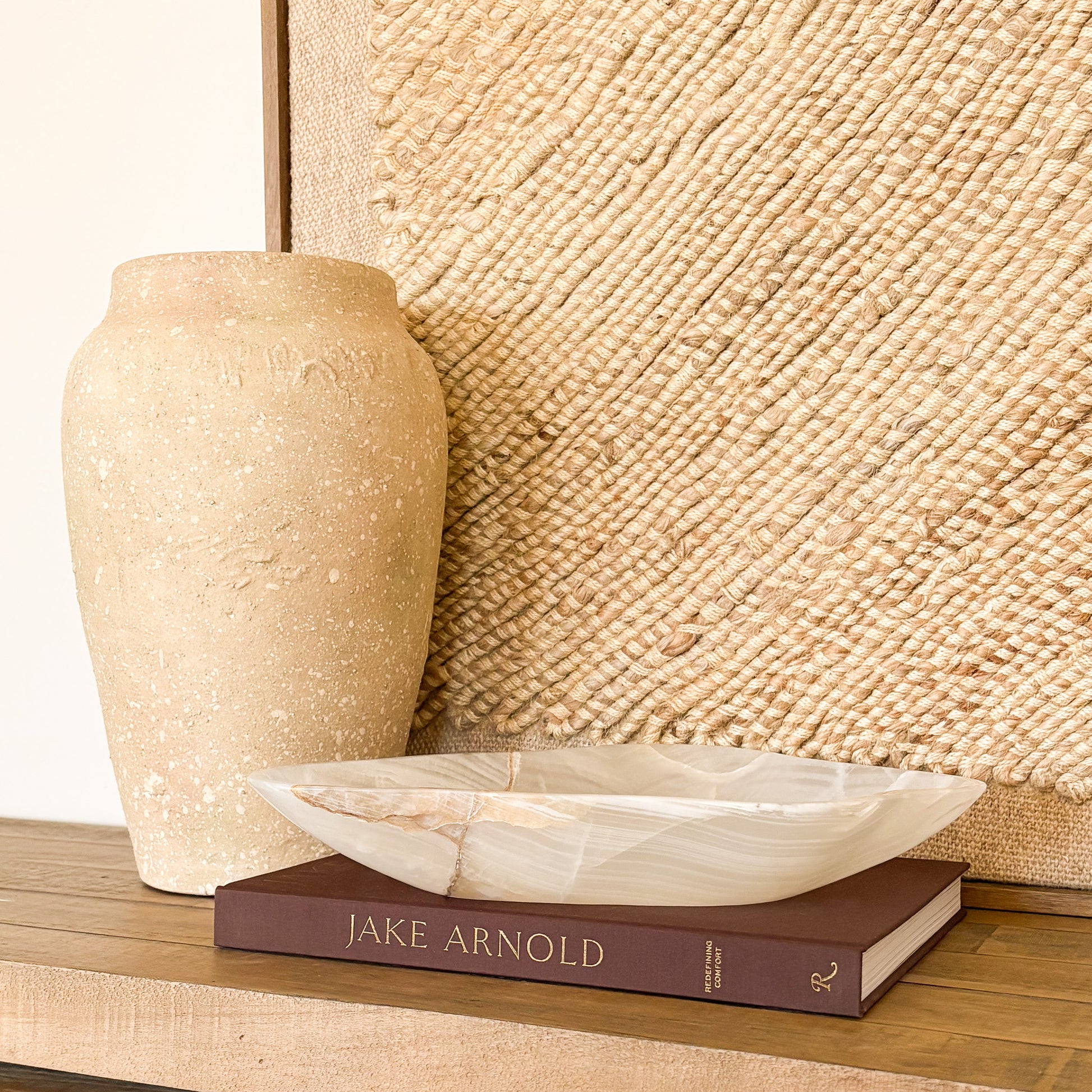 Hand carved white and amber onyx bowl styled as a luxury coffee table decor piece