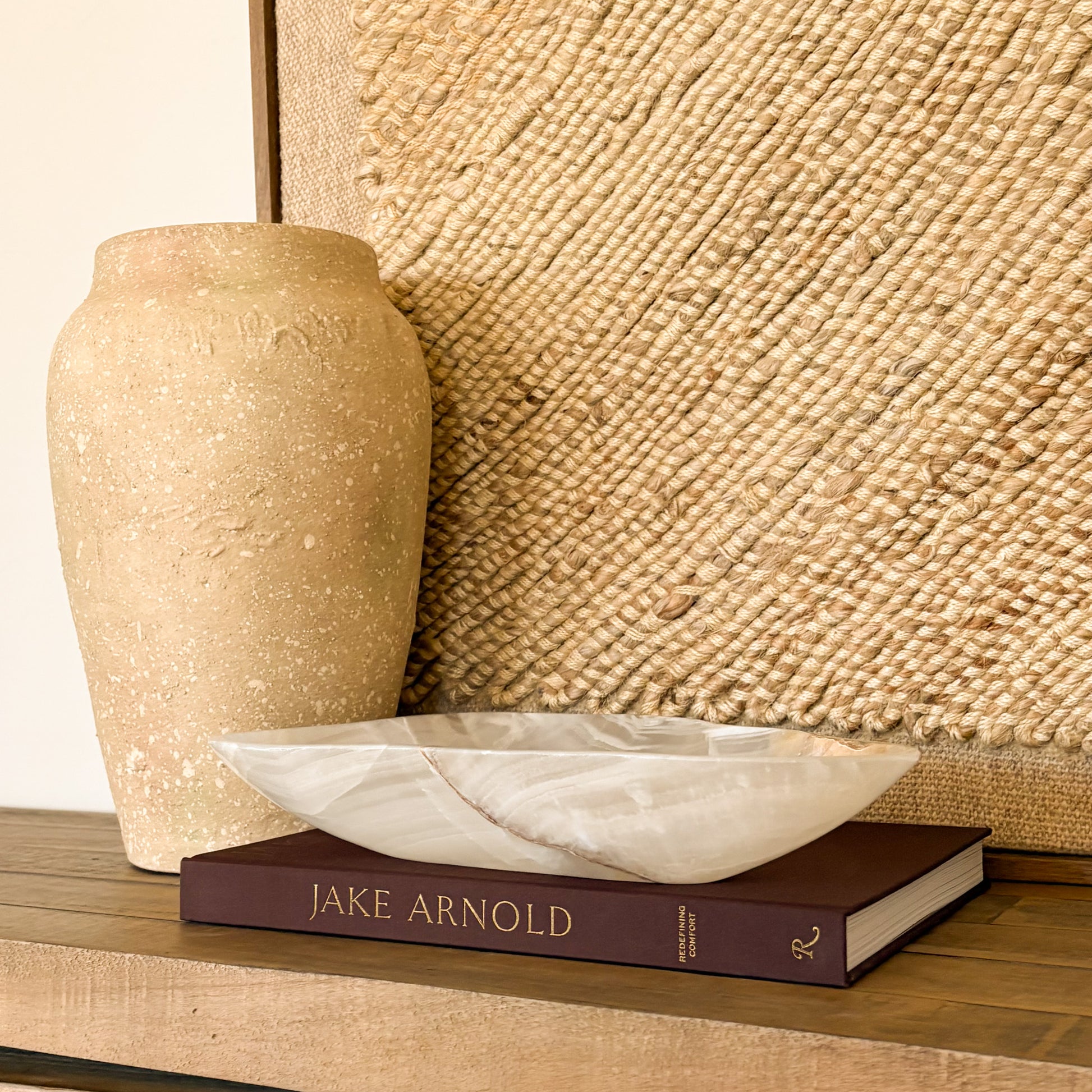 Decorative hand carved onyx bowl made from white and amber natural stone