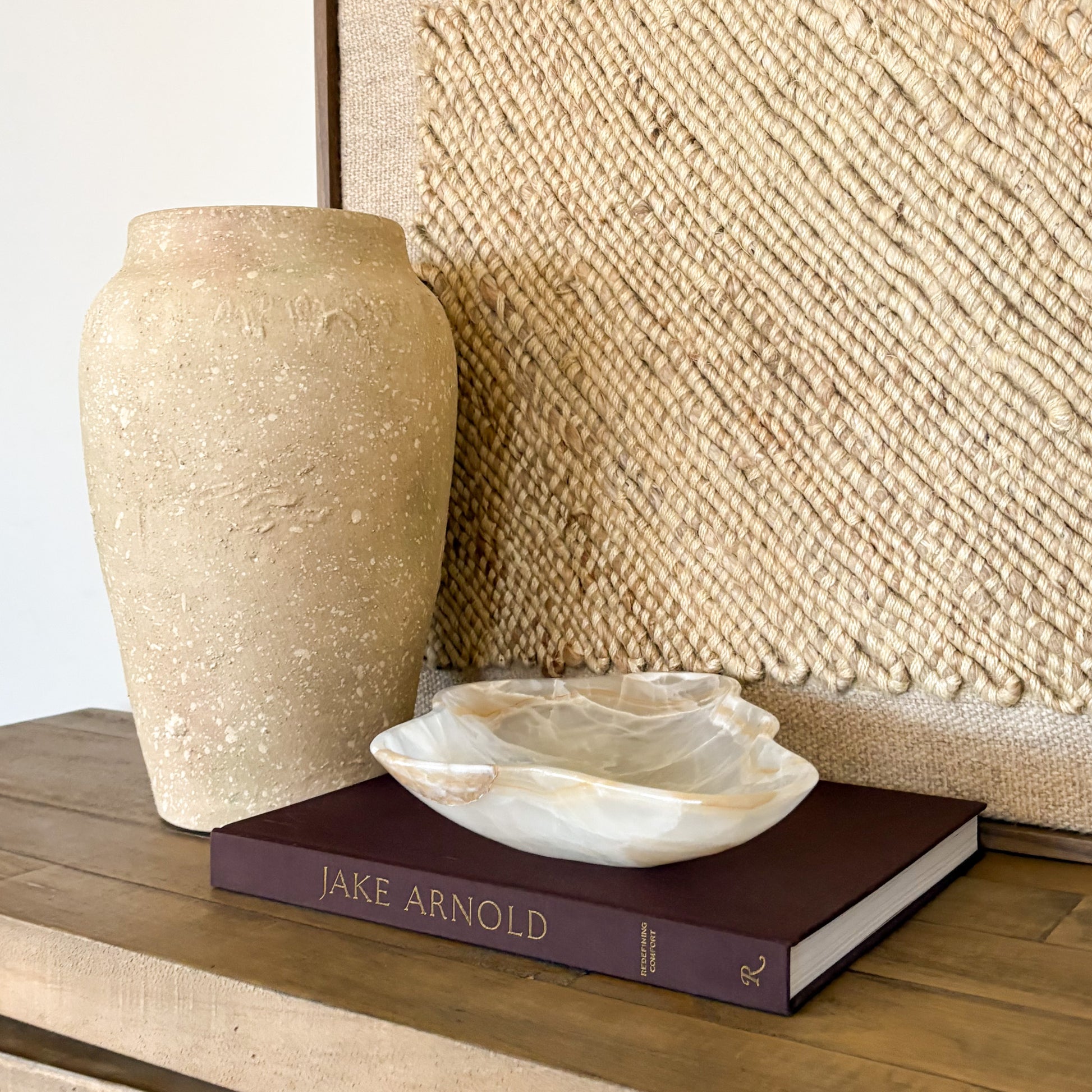 Decorative hand carved onyx bowl made from white and amber natural stone