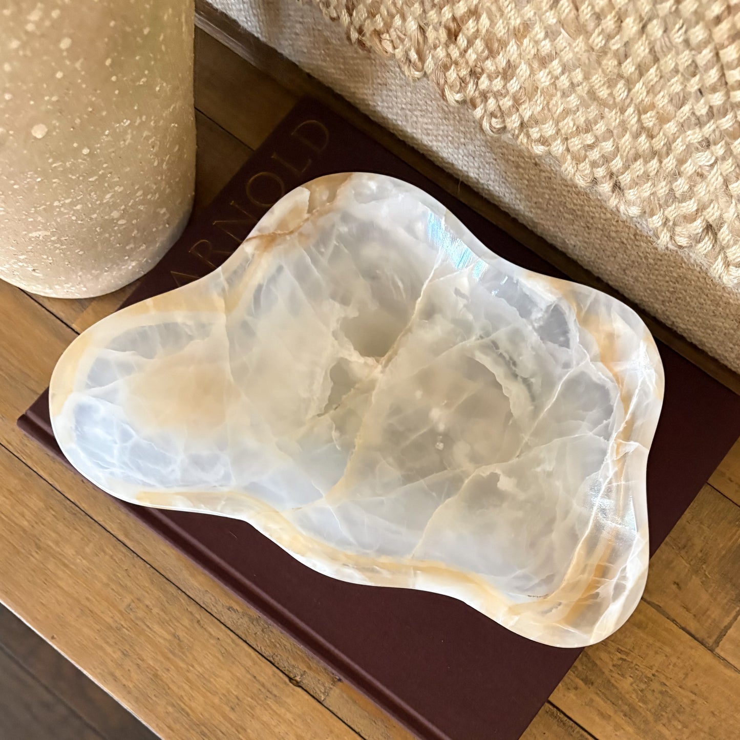 Luxury white and amber onyx decorative bowl displayed in modern interior