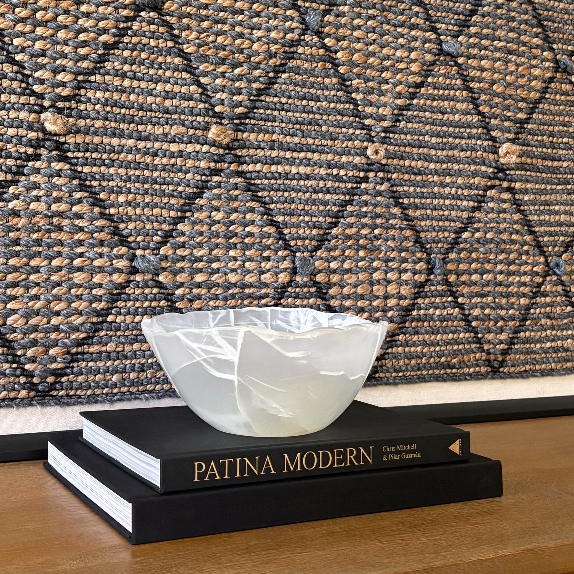 Hand-carved white onyx bowl with smooth polished finish and natural stone veining