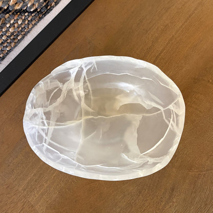 Artisan carved white onyx bowl with translucent marble-like texture