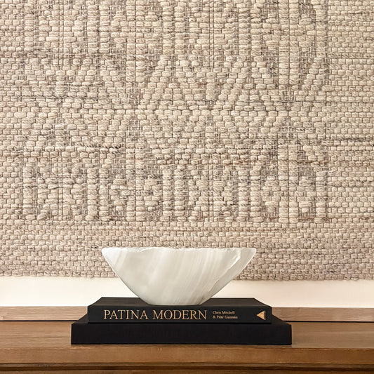 Hand-carved white onyx decorative bowl with natural stone veining