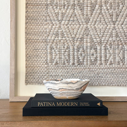 Decorative zebra calcite crystal bowl with organic edge and layered mineral banding