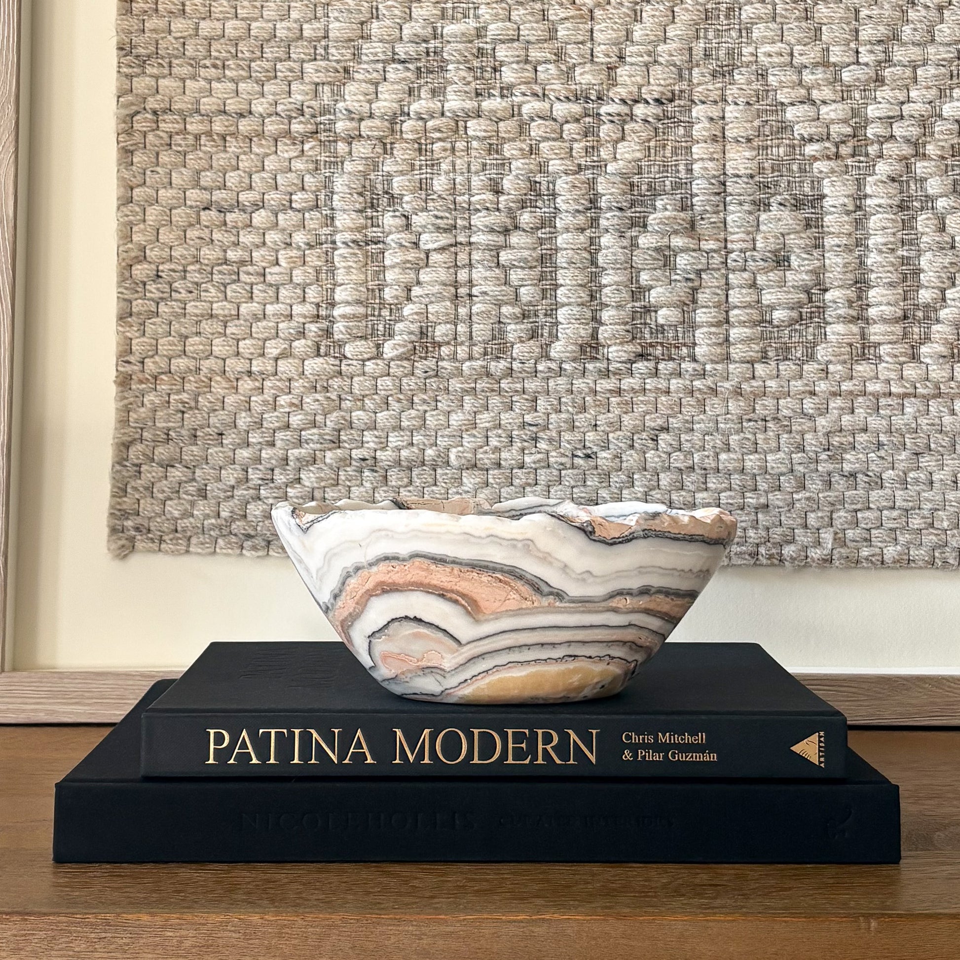 Modern luxury decor featuring hand carved zebra calcite bowl with high polish finish