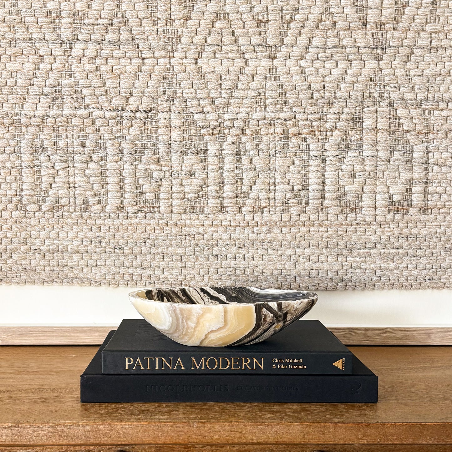 Polished zebra onyx bowl with bold black and white veining in modern home decor setting