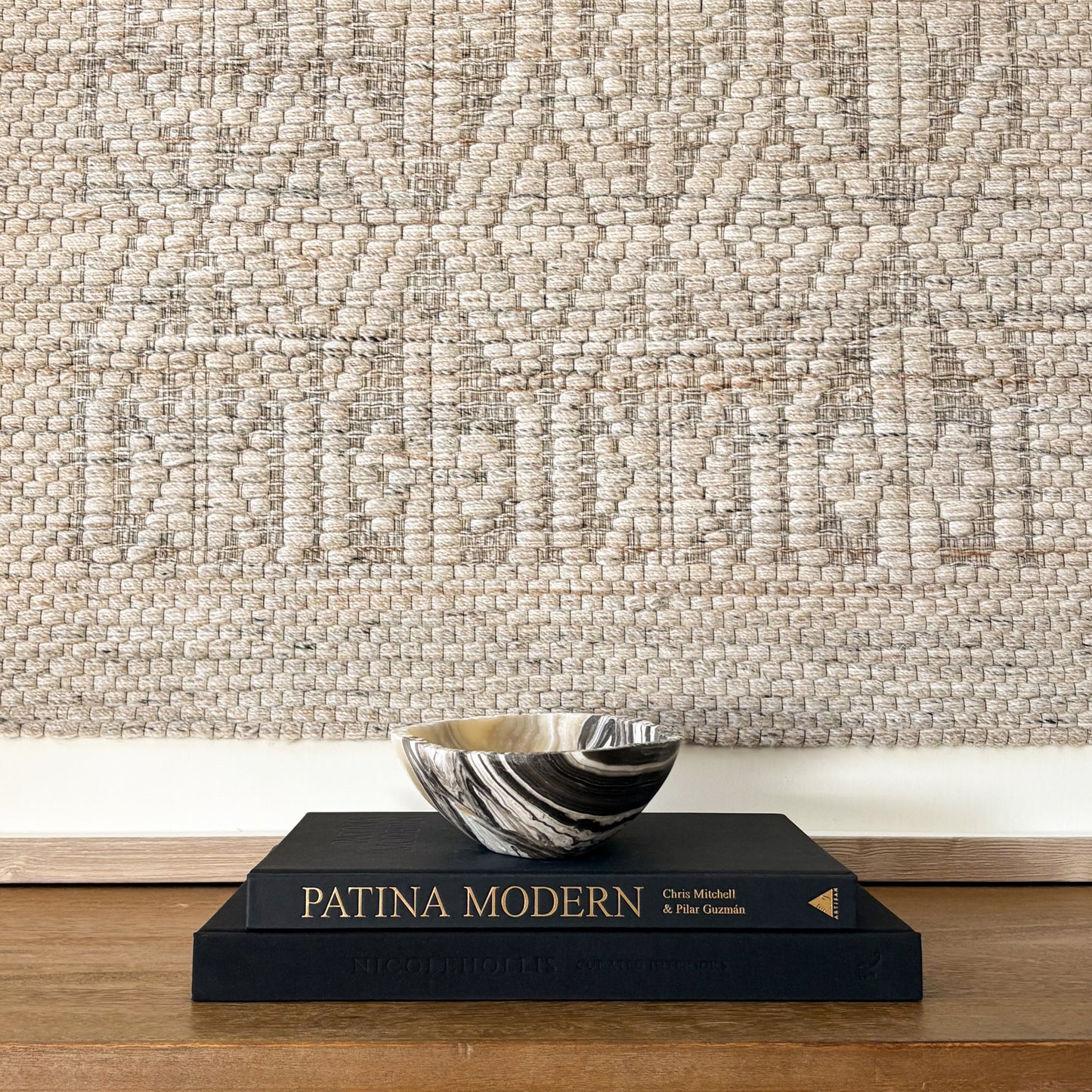 Decorative small zebra onyx bowl styled with interior design books