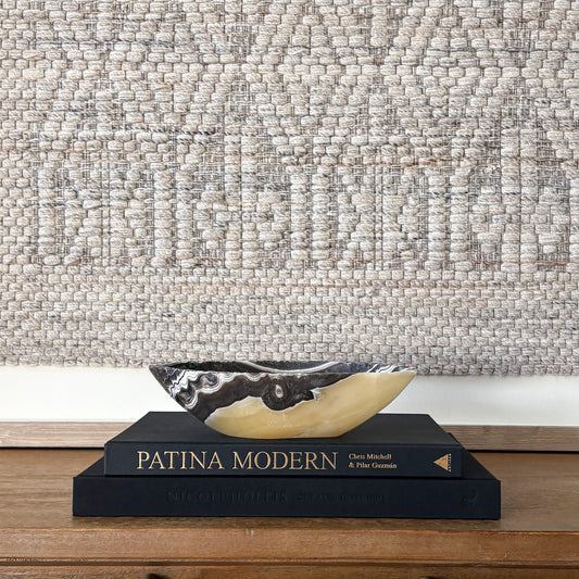 Luxury hand carved zebra onyx bowl used as modern shelf decor