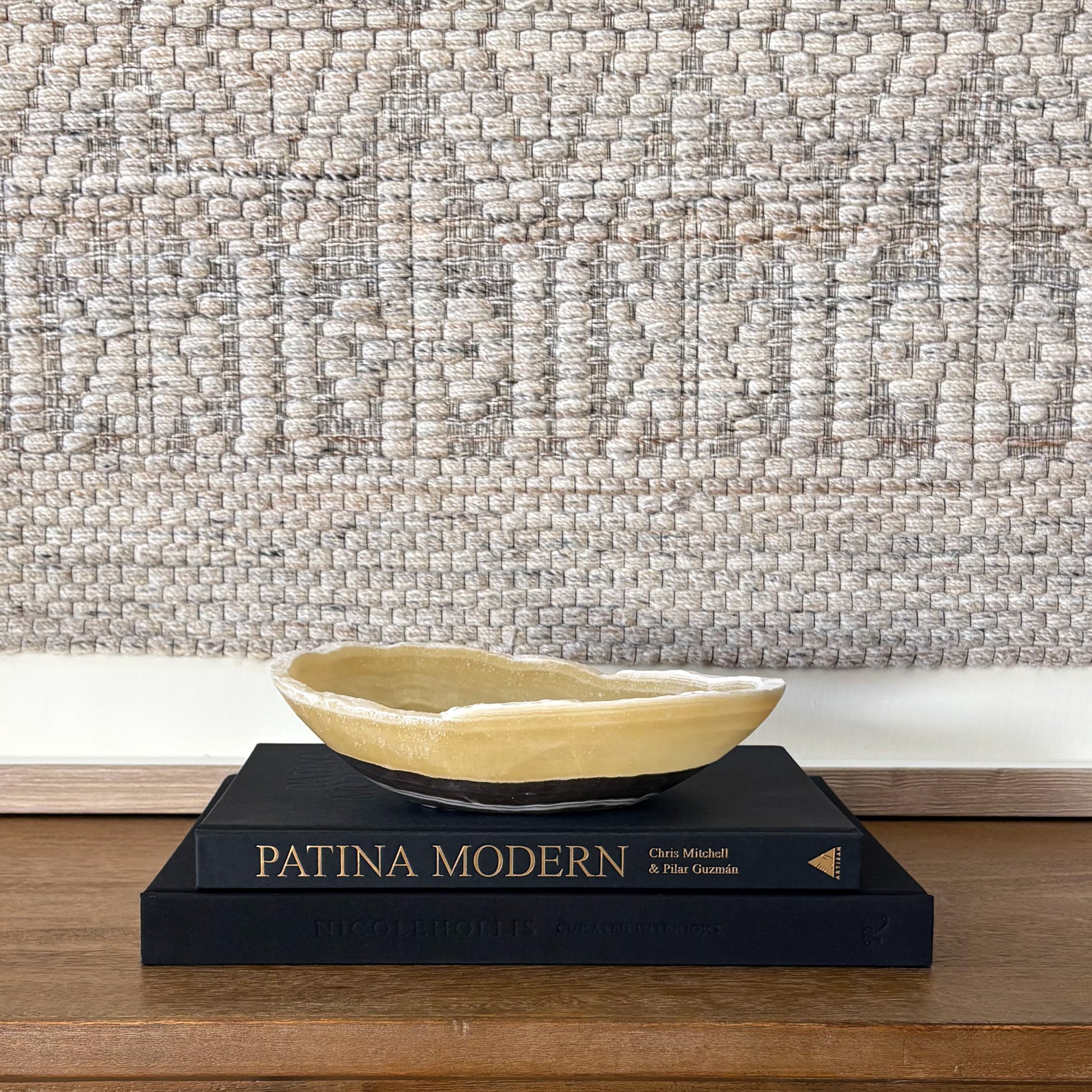 Luxury hand carved zebra onyx bowl used as modern shelf decor