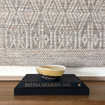 Polished zebra onyx bowl with bold black and white veining in modern home decor setting