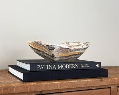 One-of-a-kind zebra onyx decorative bowl featuring bold contrasting bands of natural stone
