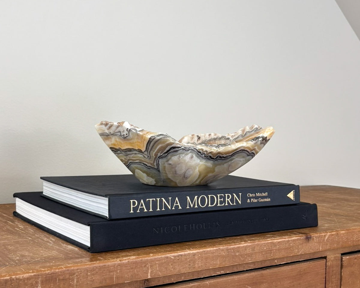 Hand-carved zebra onyx bowl with dramatic yellow, black, white and grey natural banding