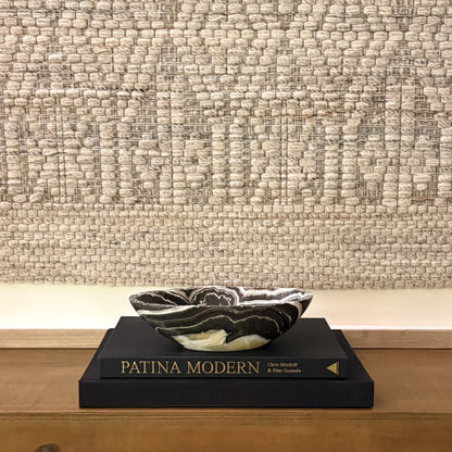 Decorative zebra onyx stone bowl, hand-carved with unique striped mineral formations and smooth interior