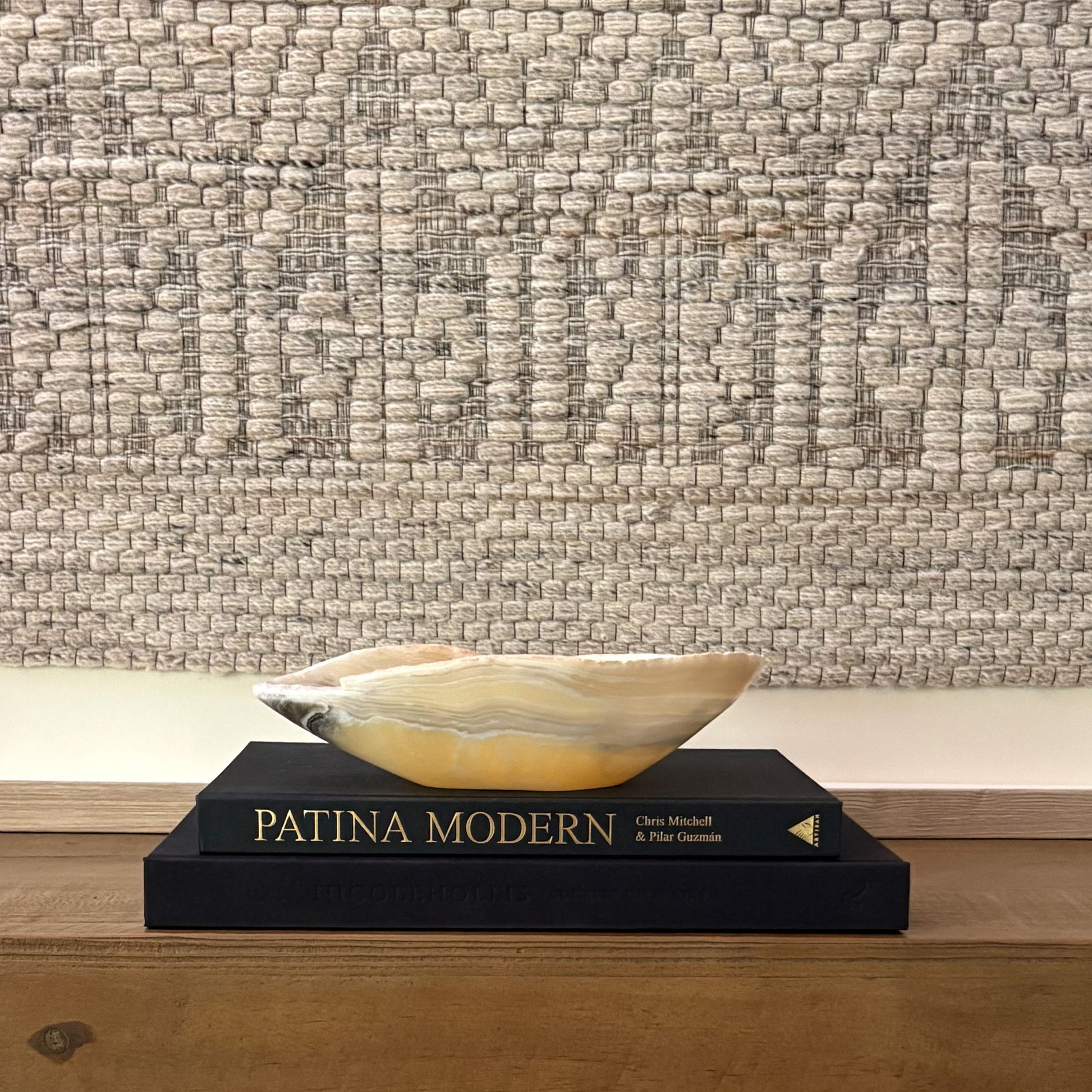 Hand-carved zebra onyx bowl used as a decorative centerpiece with bold natural stone veining