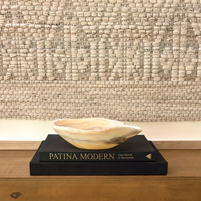 Premium hand-carved zebra onyx bowl featuring striking natural banding and polished stone texture