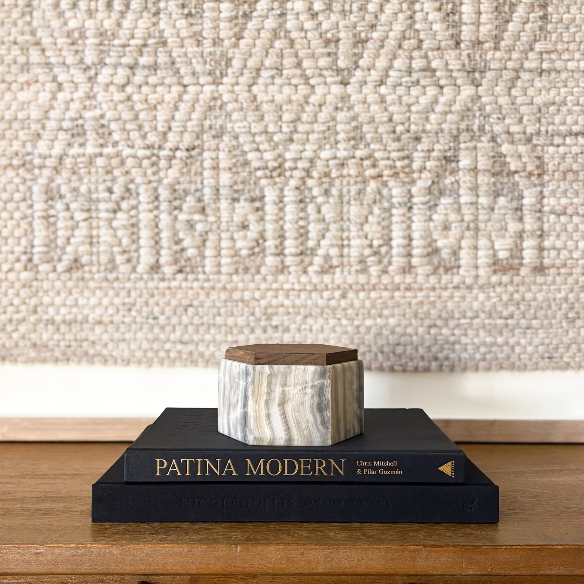 Hexagonal grey onyx box with wooden lid styled on modern coffee table books