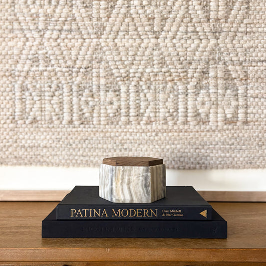 Hexagonal grey onyx box with wooden lid styled on modern coffee table books